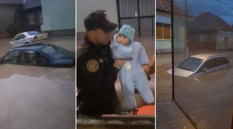 O mamă din Aiud plânge în timp ce-și evacuează bebelușul pe geam. Pompierii i-au salvat din calea apei